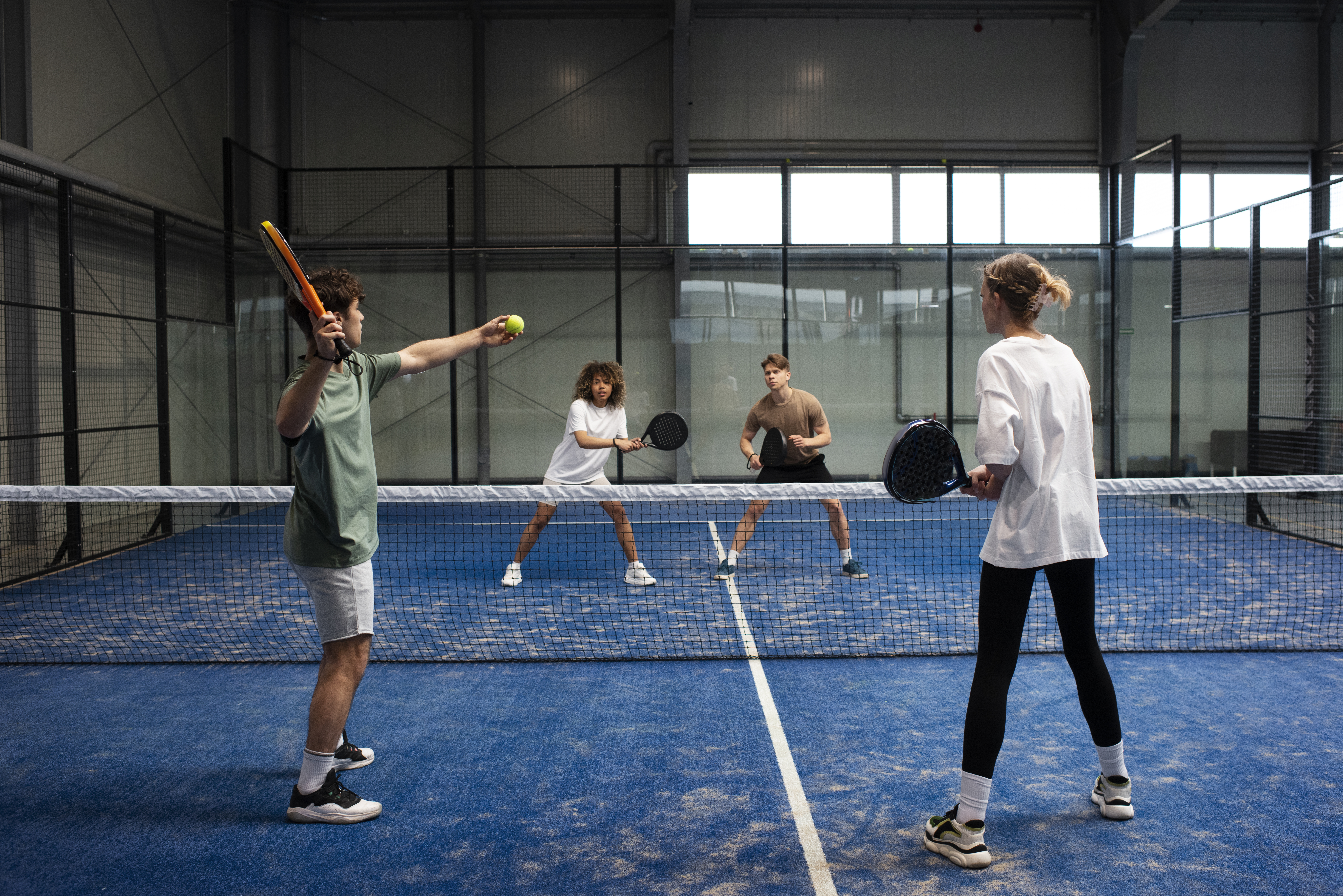 Coach guiding a padel lesson